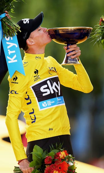 Froome cruises into Paris to win his second Tour de France